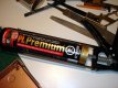 I used a renovation leftover... Polyurethane construction Adhesive.
